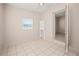 Charming bedroom with tile floors and built-in shelving at 3372 Lucerne Ter, Port Charlotte, FL 33952