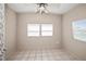Spacious bedroom with tile floors and ceiling fan at 3372 Lucerne Ter, Port Charlotte, FL 33952