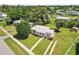 Aerial view of a single-story home with a spacious yard and driveway at 3372 Lucerne Ter, Port Charlotte, FL 33952