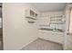 Small galley kitchen with white cabinets and granite countertops at 3372 Lucerne Ter, Port Charlotte, FL 33952