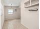 Simple dining area with tile floors and built-in shelving at 3372 Lucerne Ter, Port Charlotte, FL 33952