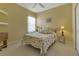 Guest bedroom with a seashell comforter and tiled floors at 1708 Palace Ct, Punta Gorda, FL 33980