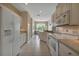 Modern kitchen with white cabinets and granite counters at 1708 Palace Ct, Punta Gorda, FL 33980