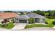 Single-story home with two-car garage and lake view at 1708 Palace Ct, Punta Gorda, FL 33980