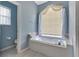 Bathroom with soaking tub and separate shower, updated finishes at 1708 Palace Ct, Punta Gorda, FL 33980