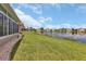 Landscaped backyard with water view and homes at 1708 Palace Ct, Punta Gorda, FL 33980