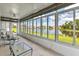 Sunroom with water view and comfortable seating at 1708 Palace Ct, Punta Gorda, FL 33980