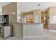 Kitchen features a breakfast bar, white cabinets, and modern appliances at 1708 Palace Ct, Punta Gorda, FL 33980