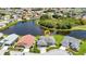 Aerial view of home near a peaceful lake at 1708 Palace Ct, Punta Gorda, FL 33980