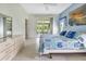 Main bedroom with tiled floors, sliding doors to the lanai, and a large bed at 1708 Palace Ct, Punta Gorda, FL 33980