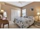 Bedroom with a floral comforter, tiled floors and plenty of closet space at 1708 Palace Ct, Punta Gorda, FL 33980