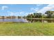 Spacious backyard with pond view and lush green grass at 1708 Palace Ct, Punta Gorda, FL 33980