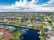 Aerial view of waterfront home with private pool and dock at 855 Pamela Dr, Punta Gorda, FL 33950