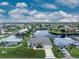 Aerial view of single-story home with canal access at 855 Pamela Dr, Punta Gorda, FL 33950