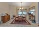 Bright breakfast nook with table and chairs, hardwood floor, and window at 5034 Hightower Rd, North Port, FL 34288