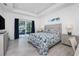 Main bedroom with large sliding doors leading to a balcony overlooking water at 1200 Gorda Cay Ln, Punta Gorda, FL 33950