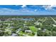 Aerial view of the property and neighborhood, highlighting its location near a lake and open spaces at 4041 Michel Tree St, Port Charlotte, FL 33948