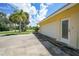 Attached garage with a side entrance and driveway at 4041 Michel Tree St, Port Charlotte, FL 33948