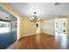 Bright dining room with hardwood floors and pool view at 4041 Michel Tree St, Port Charlotte, FL 33948