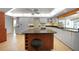 Kitchen features granite island and white cabinets at 4041 Michel Tree St, Port Charlotte, FL 33948