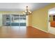 Dining room with hardwood floors and view of the pool at 4041 Michel Tree St, Port Charlotte, FL 33948