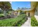 Home entrance with landscaping and walkway at 4041 Michel Tree St, Port Charlotte, FL 33948