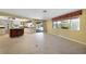Open dining area with kitchen views and tile floors at 4041 Michel Tree St, Port Charlotte, FL 33948