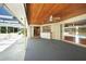 Covered patio with pool access, ceiling fan and adjacent kitchen access at 4041 Michel Tree St, Port Charlotte, FL 33948