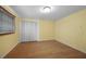 Simple bedroom with bamboo flooring and double door closet at 4041 Michel Tree St, Port Charlotte, FL 33948