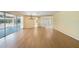 Spacious living area with hardwood floors and a view of the pool at 4041 Michel Tree St, Port Charlotte, FL 33948