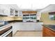 White kitchen with granite countertops and pool view at 4041 Michel Tree St, Port Charlotte, FL 33948