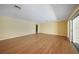 Living room with hardwood floors and sliding glass doors at 4041 Michel Tree St, Port Charlotte, FL 33948