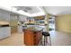 Spacious kitchen with island, white cabinets, and granite countertops at 4041 Michel Tree St, Port Charlotte, FL 33948