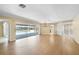 Spacious living area with hardwood floors and a view of the pool at 4041 Michel Tree St, Port Charlotte, FL 33948