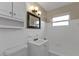 Clean bathroom with white tile, vanity, and bathtub at 22473 Hernando Ave, Port Charlotte, FL 33952