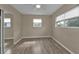 Bedroom with mirrored closet and wood-look floors at 22473 Hernando Ave, Port Charlotte, FL 33952