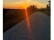 Long country road at sunset, beautiful colors at 15300 Water Oak Ct, Punta Gorda, FL 33982