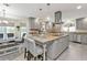Large kitchen island with seating, granite countertops and modern appliances at 15300 Water Oak Ct, Punta Gorda, FL 33982