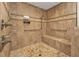 Walk-in shower with grab bars and neutral-toned tile at 15300 Water Oak Ct, Punta Gorda, FL 33982