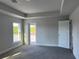 Primary bedroom with carpet flooring and exterior access at 10045 Bay State Dr, Port Charlotte, FL 33981