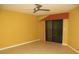 Bedroom with sliding glass door, ceiling fan, and tiled flooring at 601 Shreve St # 12B, Punta Gorda, FL 33950