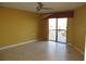 Bedroom with water view from sliding glass door, ceiling fan, and tile floor at 601 Shreve St # 12B, Punta Gorda, FL 33950
