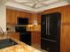 Updated kitchen featuring granite counters, black appliances, and ample cabinetry at 601 Shreve St # 12B, Punta Gorda, FL 33950