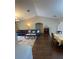 Spacious living area with hardwood floors and a vaulted ceiling at 2106 Switzerland Rd, North Port, FL 34288