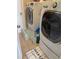 Laundry room with LG washer and dryer, and tile floor at 2106 Switzerland Rd, North Port, FL 34288