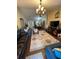 Living room with hardwood floors, couches and a view of the dining room at 2106 Switzerland Rd, North Port, FL 34288