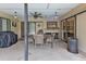 Covered patio with table and chairs, perfect for outdoor dining at 791 Haleybury St, Port Charlotte, FL 33948