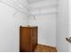 Walk-in closet with wire shelving and wood-look flooring at 791 Haleybury St, Port Charlotte, FL 33948