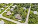 Aerial view showing home, pool, and surrounding neighborhood at 791 Haleybury St, Port Charlotte, FL 33948