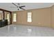 Spacious bedroom with tiled floors and ceiling fan at 791 Haleybury St, Port Charlotte, FL 33948
